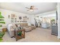 Inviting living room flows into a modern kitchen, featuring stylish decor and comfortable seating at 248 Amber Acorn Ave, Raleigh, NC 27603