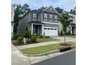 Attractive home with well-maintained landscaping, a two-car garage, and a covered entrance at 4940 Enlightenment Rd, Raleigh, NC 27616