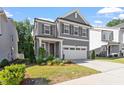 Attractive two-story home with a two-car garage and landscaped front yard at 4940 Enlightenment Rd, Raleigh, NC 27616