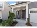 Cozy front porch with stone accents and well-maintained landscaping at 4940 Enlightenment Rd, Raleigh, NC 27616