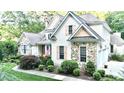 Charming home with a combination of stone and siding, enhanced by lush landscaping at 5920 Two Pines Trl, Wake Forest, NC 27587