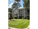 Inviting two-story house featuring a well-kept lawn and charming curb appeal at 627 New Road, Raleigh, NC 27608