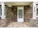 Close-up of the stone-clad front porch and entrance to the charming home at 919 Chester St, Durham, NC 27701