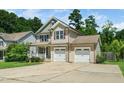 Charming home with a two-car garage and well-maintained landscaping at 11612 Leesville Rd, Raleigh, NC 27613