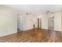 A bright living room with light walls, hardwood flooring, and a ceiling fan at 205 Ashley Forest Rd # Bldg D, Chapel Hill, NC 27514