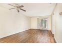 A light-filled living room features attractive hardwood flooring and sliding glass doors at 205 Ashley Forest Rd # Bldg D, Chapel Hill, NC 27514