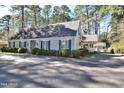 Charming home with manicured bushes, classic shutters, and a covered carport, offering a blend of comfort at 322 Gravley Dr, Rocky Mount, NC 27804