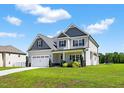 Attractive two-story house with a two-car garage and a well-kept lawn at 414 Fallingbrook Dr, Kenly, NC 27542