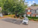 Neighborhood aerial view of townhomes, with landscaped front yards and easily accessible parking at 4406 Still Pines Dr, Raleigh, NC 27613