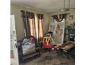 Spacious living room featuring large windows and a vintage mirror at 505 S 15Th St, Erwin, NC 28339