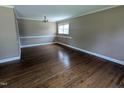 Spacious living room with hardwood floors, crown molding and natural light at 520 Charlotte Ave, Rocky Mount, NC 27804