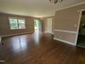 Inviting living room featuring gleaming hardwood floors and neutral paint at 520 Charlotte Ave, Rocky Mount, NC 27804