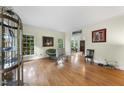 Bright living room with large windows and hardwood floors perfect for entertaining at 821 Ascot Ln, Raleigh, NC 27615