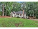 Attractive single-story home featuring a welcoming front porch and well-maintained landscaping at 8801 Valley Hill Ct, Apex, NC 27539