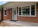 Close-up of the brick facade and inviting front porch at 110 Starlite Dr, Carrboro, NC 27510