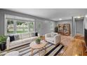 Cozy living room with stylish furniture, hardwood floors, and natural light at 110 Starlite Dr, Carrboro, NC 27510