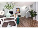 Inviting living room with hardwood floors, fireplace, and stylish decor, perfect for relaxing and entertaining at 320 Gilman Ln # 106, Raleigh, NC 27610