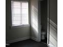Bright bathroom featuring a toilet and window with white trim at 3514 S Alston Ave, Durham, NC 27713