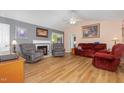 Cozy living room with vaulted ceilings, fireplace, and comfortable seating at 6408 Glen Brack Ct, Raleigh, NC 27603