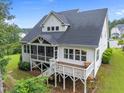 Inviting backyard featuring a screened porch and a deck perfect for outdoor relaxation and entertaining at 7502 Latteri Ct, Raleigh, NC 27613
