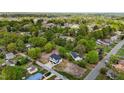 The aerial view displays a modern two-story home in a green neighborhood with mature trees at 834-836 Day Ave, Burlington, NC 27217