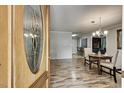 View of dining room with wood floors and open access to kitchen area at 835 Pearleman Teague Rd, Siler City, NC 27344