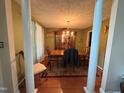 Traditional dining room with wood floors, chandelier, and classic furniture at 100 Deer Ridge Rd, Siler City, NC 27344