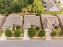 Aerial view showcasing the home's roof, surrounding community and landscaped yards at 1104 Gaston Manor Dr, Durham, NC 27703