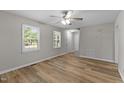 Bright living room featuring durable floors, fresh paint, and ample natural light at 113 Fox Run, Henderson, NC 27536