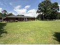Expansive backyard featuring a lush green lawn perfect for outdoor activities and relaxation at 12082 Nc 42, Fuquay Varina, NC 27526