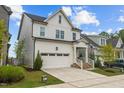Beautiful two-story home with a well-manicured lawn and a convenient two-car garage at 140 Big Barn Dr, Wendell, NC 27591