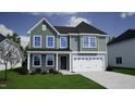 Charming two-story home with a two-car garage and manicured front lawn at 140 Cordoba Dr, Franklinton, NC 27525
