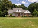 Beautiful brick home with a front porch and well-maintained landscaping at 2819 Russell Mcpherson Rd, Burlington, NC 27215