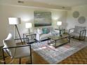 Bright living room with neutral furniture and hardwood floors at 3738 Jamestown Cir, Raleigh, NC 27609