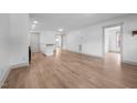 Spacious living room featuring neutral paint, updated flooring, and an open floor plan at 502 S Eighth St, Mebane, NC 27302