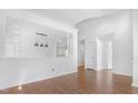 Spacious living room with hardwood floors, white walls, and an open concept at 613 Penncross Dr, Raleigh, NC 27610
