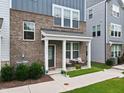 Inviting front porch with seating area, brick exterior, and well-kept landscaping at 6928 Leesville Rd, Raleigh, NC 27613