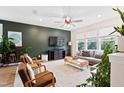 Stylish living room featuring modern furniture, large windows, and a cozy atmosphere at 6928 Leesville Rd, Raleigh, NC 27613