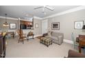 Open-concept living room with a view of the kitchen, creating a welcoming and functional space at 734 Portstewart Dr, Cary, NC 27519
