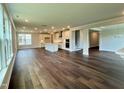 Bright and airy living area with hardwood floors and views into the kitchen and other living spaces at 772 Emerald Bay Cir # 768, Raleigh, NC 27610