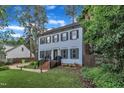 Charming two-story home with a well-maintained lawn, brick stairs, and a classic front door at 7917 Featherstone Dr, Raleigh, NC 27615