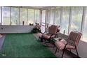 Inviting screened porch with comfortable seating, perfect for relaxing outdoors at 3555 Nc 98 Hwy, Youngsville, NC 27596