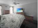 Inviting main bedroom features a ceiling fan, light wood furniture, and a serene ambiance for relaxation at 3624 Meadow Creek Ln, Raleigh, NC 27616