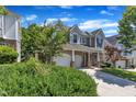Beautiful two-story home with a landscaped yard, large windows, and a two-car garage at 413 Westfalen Dr, Cary, NC 27519