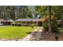 Well-maintained single story brick home with an adjacent covered carport and a mature, landscaped front yard at 625 Powell Dr, Rocky Mount, NC 27803
