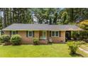 Charming single-story brick home featuring a well-maintained lawn and a welcoming front entrance at 625 Powell Dr, Rocky Mount, NC 27803