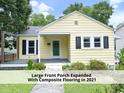 Inviting yellow bungalow featuring a large front porch expanded with composite flooring in 2021 at 1410 Shawnee St, Durham, NC 27701