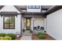 Inviting front porch with seating, decor, and a welcoming entrance at 15 Willow Bend Dr, Youngsville, NC 27596