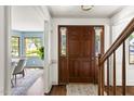 Welcoming foyer with hardwood floors, staircase, and view into the dining room at 16 Cedar Hill Dr, Durham, NC 27713