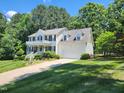 A lovely home with an attached two-car garage and pristine landscaping at 18 Clover Hil Pl, Durham, NC 27712